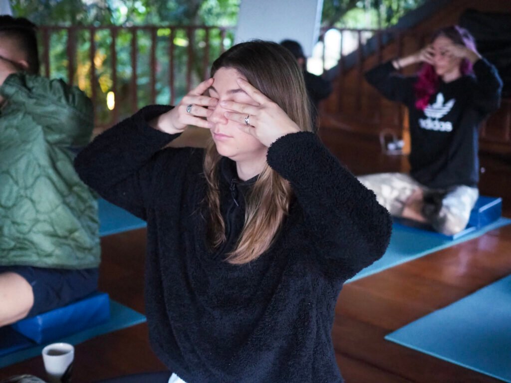 Beginner practicing yoga poses at home before starting 200-hour YTT