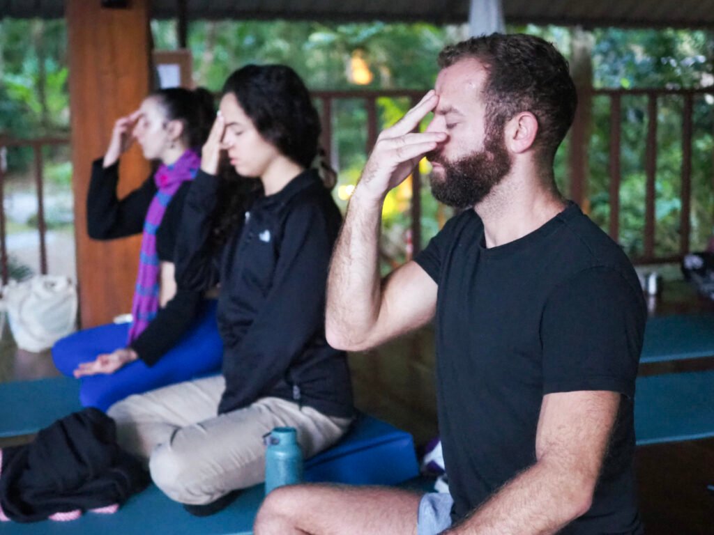 Person practicing pranayama breathing technique for beginners